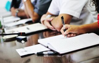 Business people on meeting conference taking notes and make deal