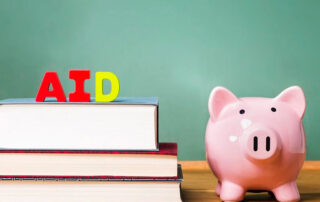 Student AID theme with textbooks, piggy bank, and green chalkboard in background